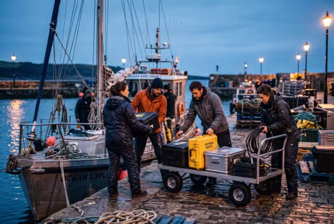 Expedition gear unloaded at the quay — News imagery, fieldwork return.